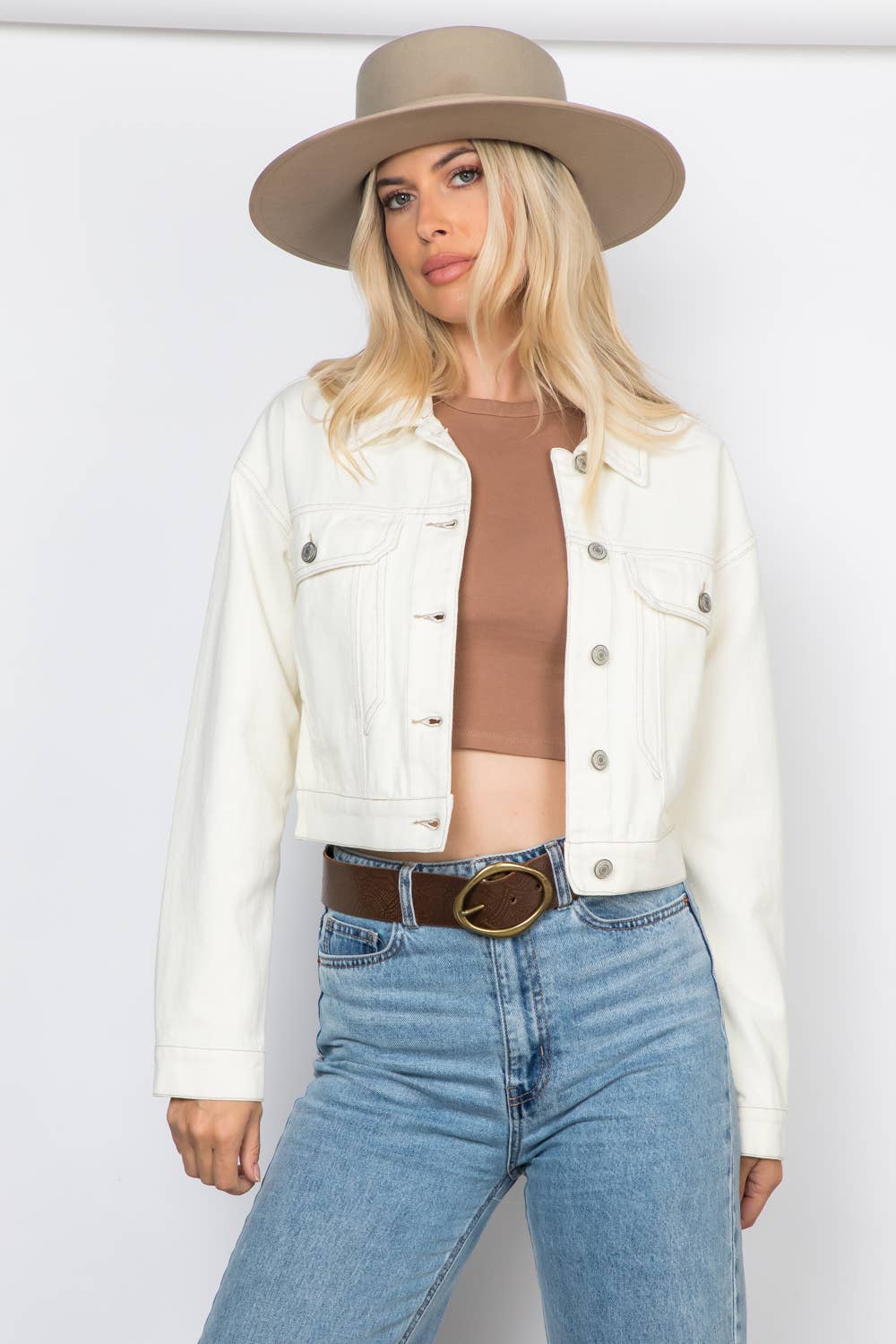 Ecru Cropped Ecru Denim Jacket Outerwear by 26 International front on model wearing hat, crop top, jeans, belt looking at camera