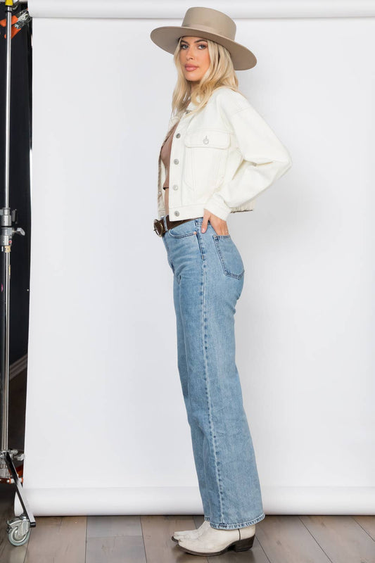 Cropped Ecru Denim Jacket Outerwear by 26 International left full model view standing looking at camera wearing hat jeans and boots