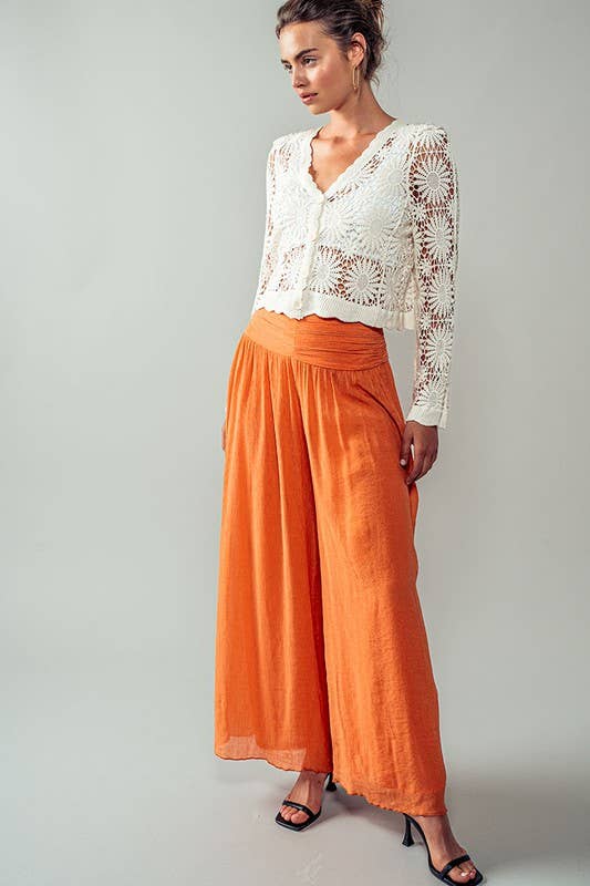 Floral Crochet Button Down Cropped Cardigan Cardigan by Urban Daizy off-white front left on model buttoned up looking right with full view of outfit and heels