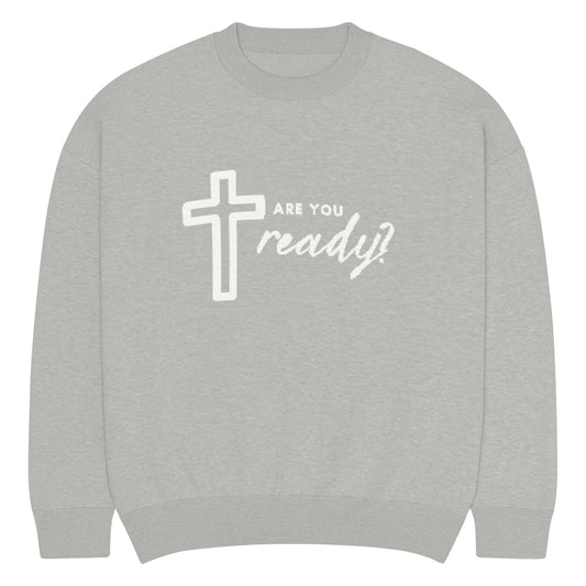 Front of Gray knitted sweatshirt with a white cross and text 