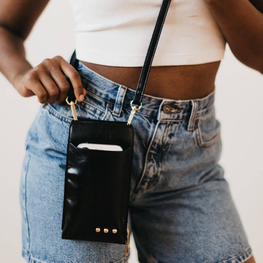 Black Double Duty Phone Crossbody Wallet Wallet by Pretty Simple front on model zoomed in worn crossbody style with phone in pocket