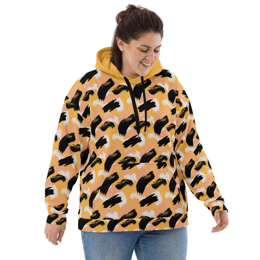 Front of Woman wearing a yellow hoodie with abstract pattern 