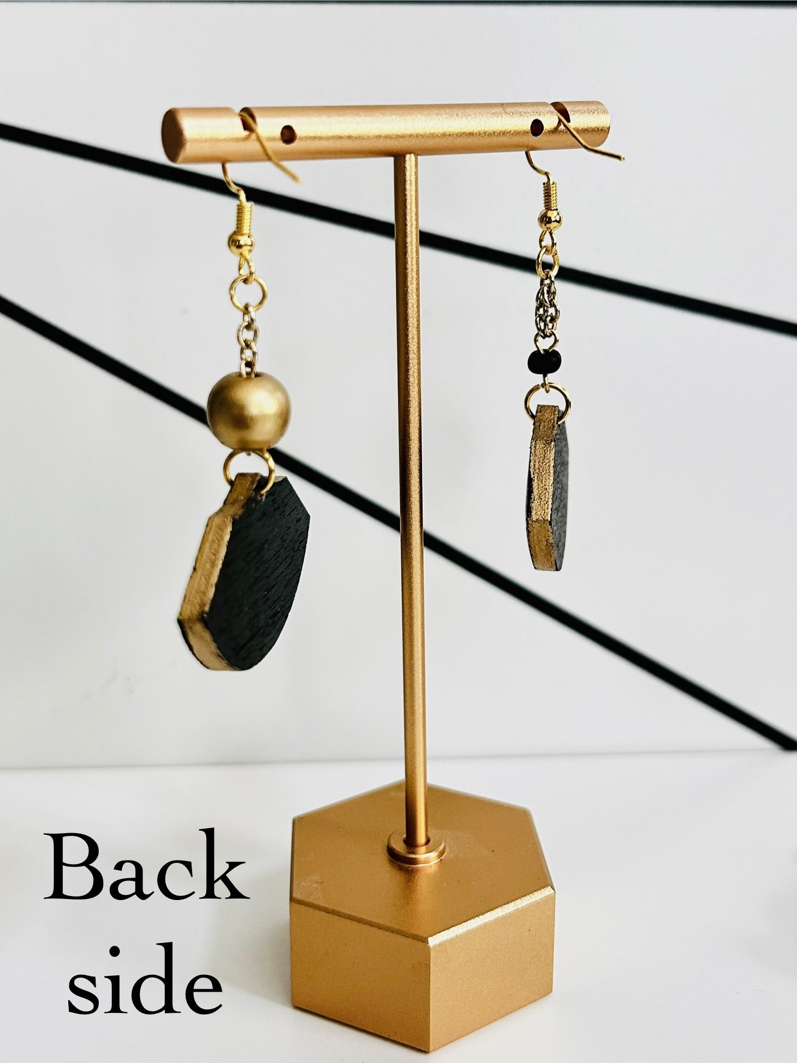 Daring Damask Detail Wood Earrings Earrings by Carl & Lyn left side back side black and gold on earring stand