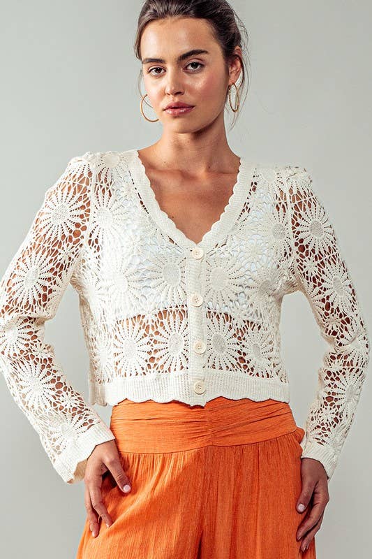 Floral Crochet Button Down Cropped Cardigan Cardigan by Urban Daizy Off-white front on model looking at camera wearing pants with hands on waist