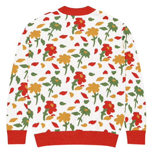 Back of green, red, yellow Floral patterned cardigan with red trim