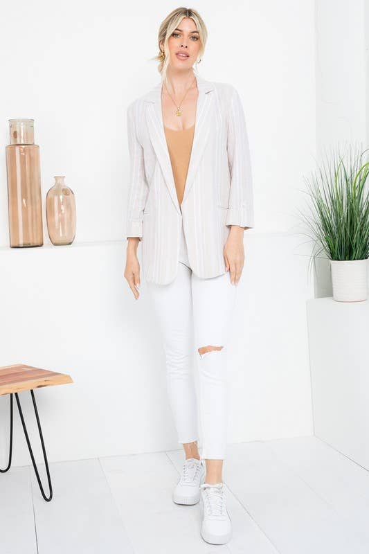 Linen Blend Stripe Roll Up Blazer Outerwear by 26 International tan white front on model standing in room wearing top and jeans with shoes and hands at side looking at camera