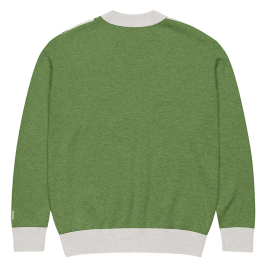 Back of Knitted Green cardigan with white trim on a white background