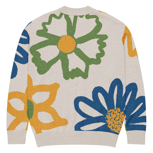 Back of off-white cardigan with a colorful floral pattern