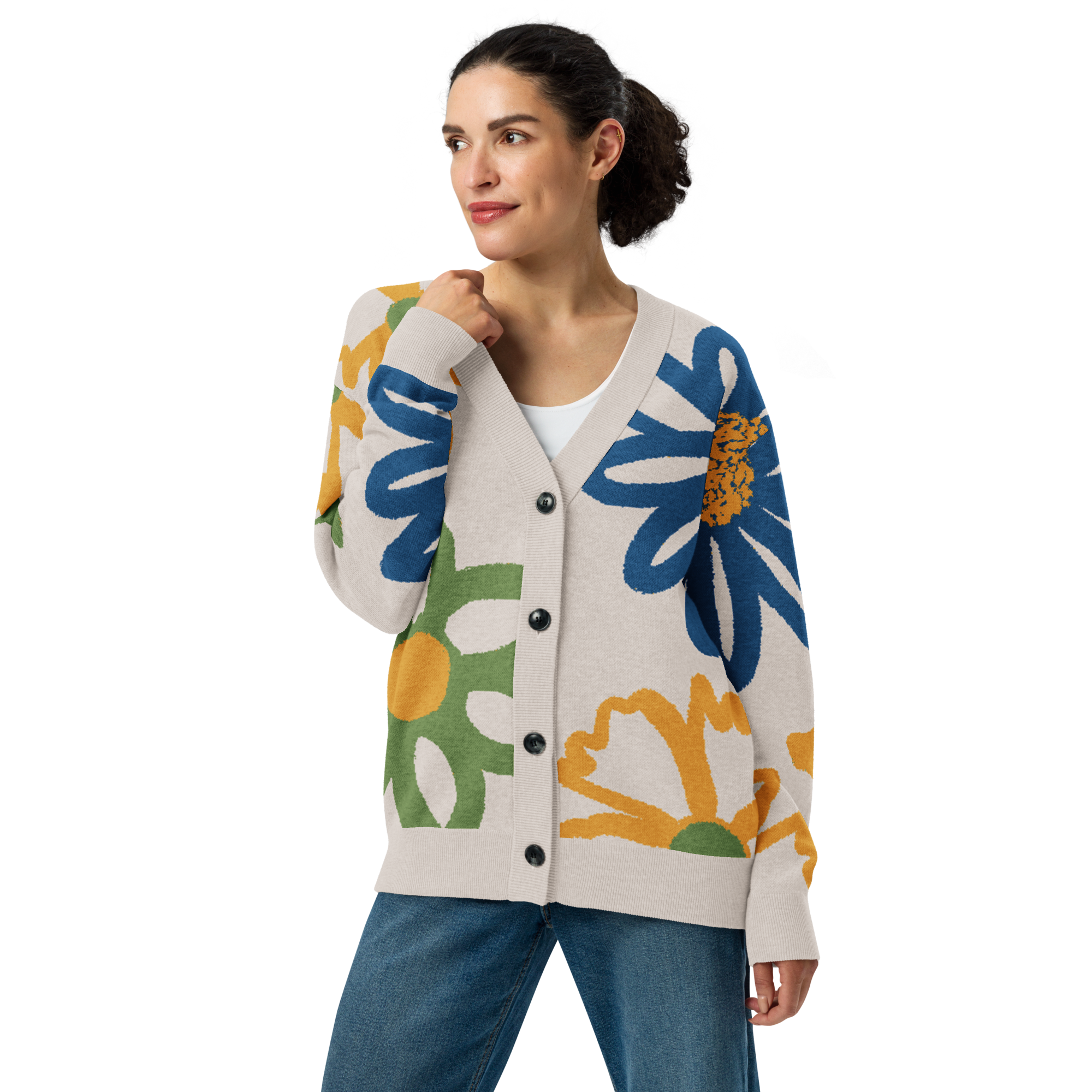 Front of Woman wearing a colorful floral cardigan that is buttoned up, wearing blue jeans with right arm bent toward face
