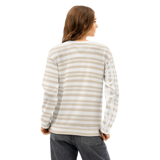 Back of Woman wearing a striped long-sleeve sweatshirt with tan and white stripes and tan and white checkered pattern on right sleeve 