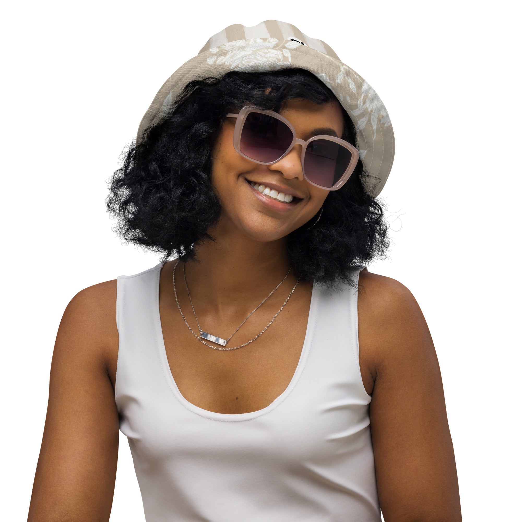 Outside Front of Woman wearing a white tank top, tan/white striped hat, and sunglasses 
