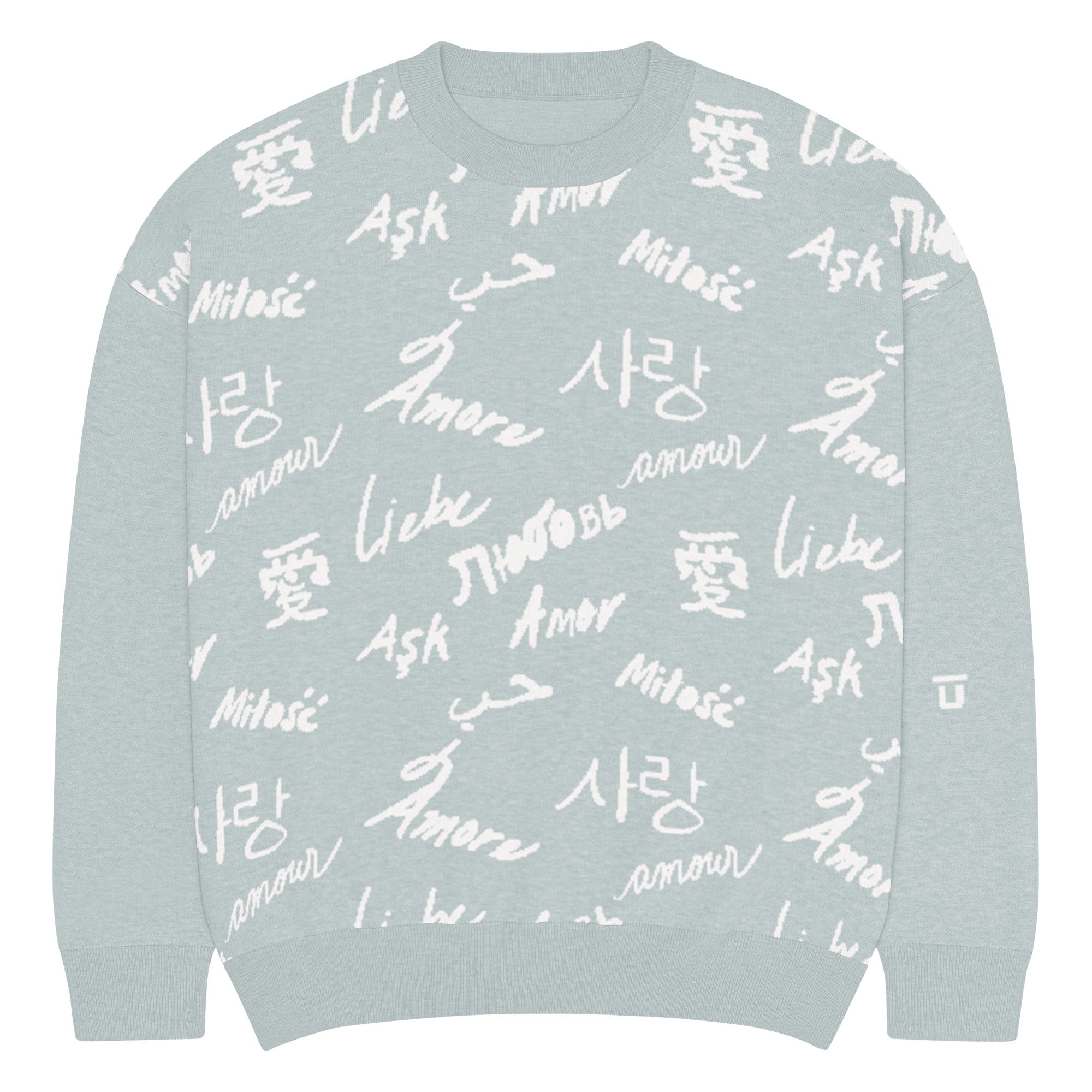 Front of light green (mist) colored knitted sweatshirt with white (cream) text pattern of the word "love" translated in various languages