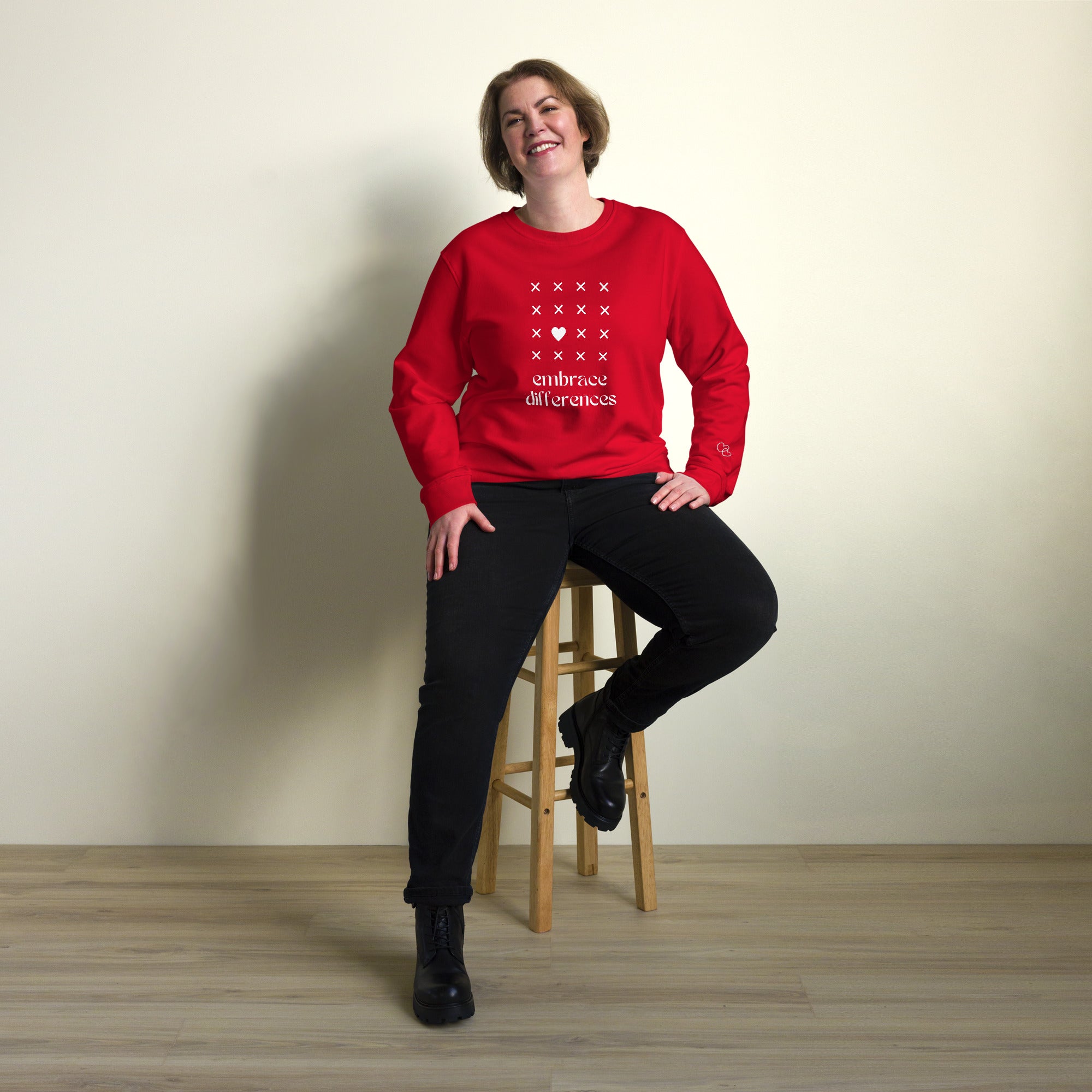 Embrace differences - Eco Sweatshirt Sweatshirt by Carl & Lyn red front person sitting